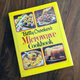 Copy of Betty Crocker's Microwave Cookbook, 1981 edition, sitting on wooden table